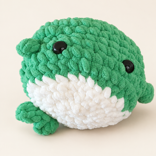 Crochet turtle with a clean ivory background