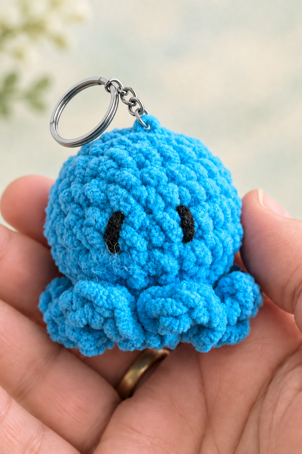 Blue crocheted octopus with silver key ring