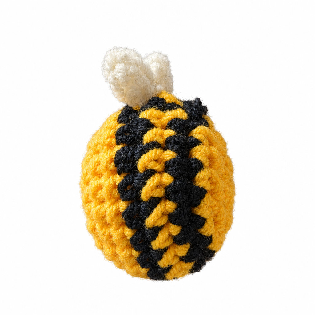 Crocheted bear plush side view, white background